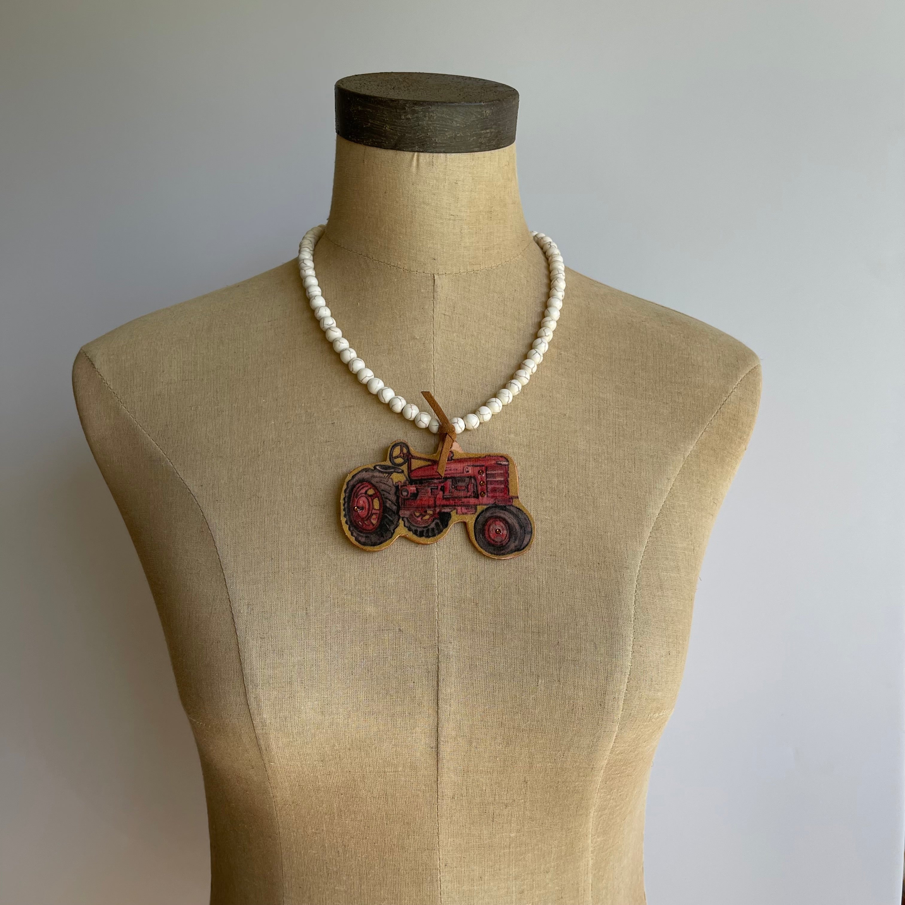 Red Tractor Necklace White Beads Red Tractor Image